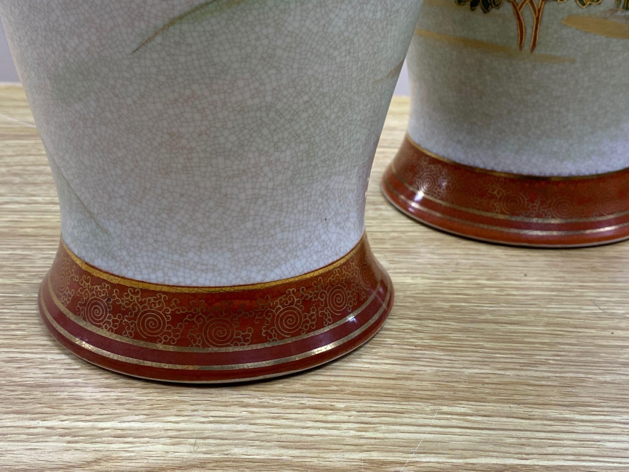 A pair of Japanese satsuma baluster vases, height 46cm, and a satsuma bulbous vase, height 37cm